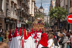 Nazarenos leading the paso through the streets